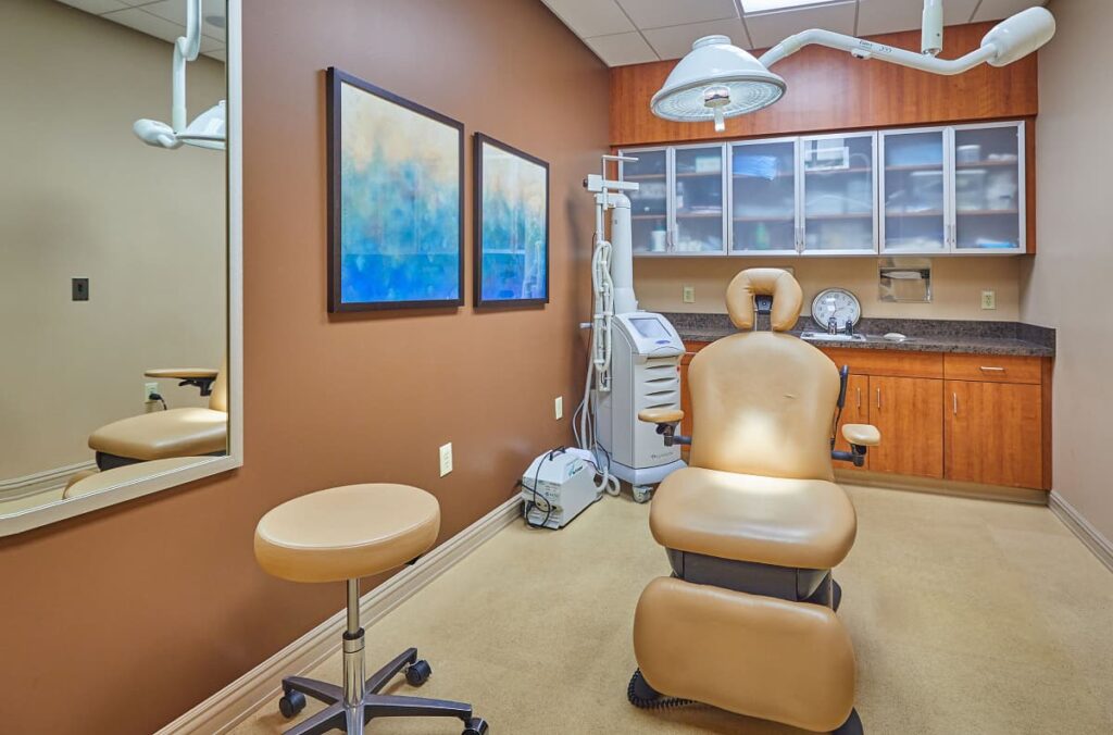 Medical spa treatment room with patient chair for facials, lasers, nonsurgical fat reduction with CoolSculpting, and more from nurses, aestheticians, and physician assistants