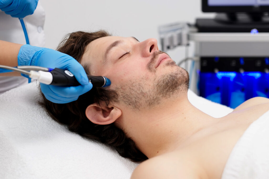 Man getting a Hydrafacial for Him men's facial at a medical spa