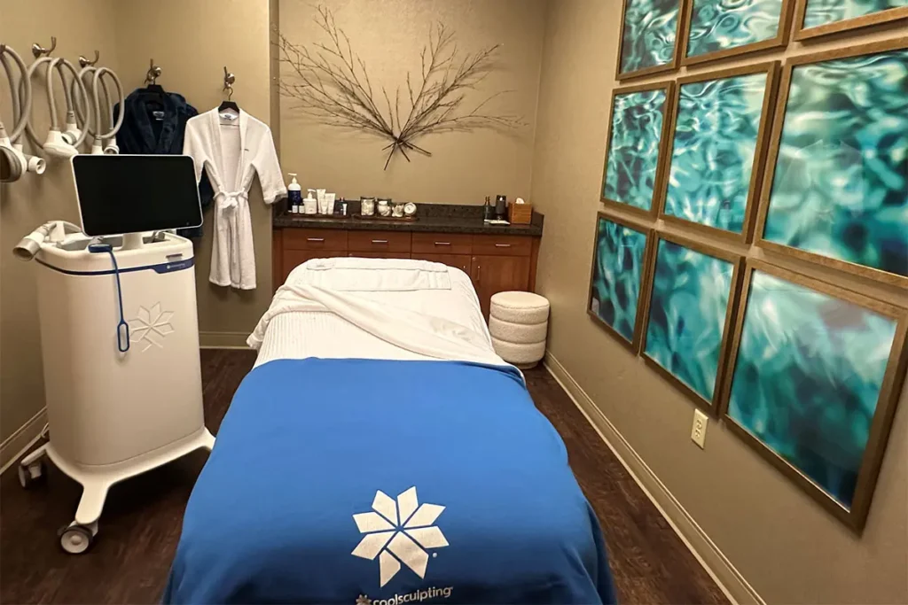 CoolSculpting treatment room with equipment and decor.