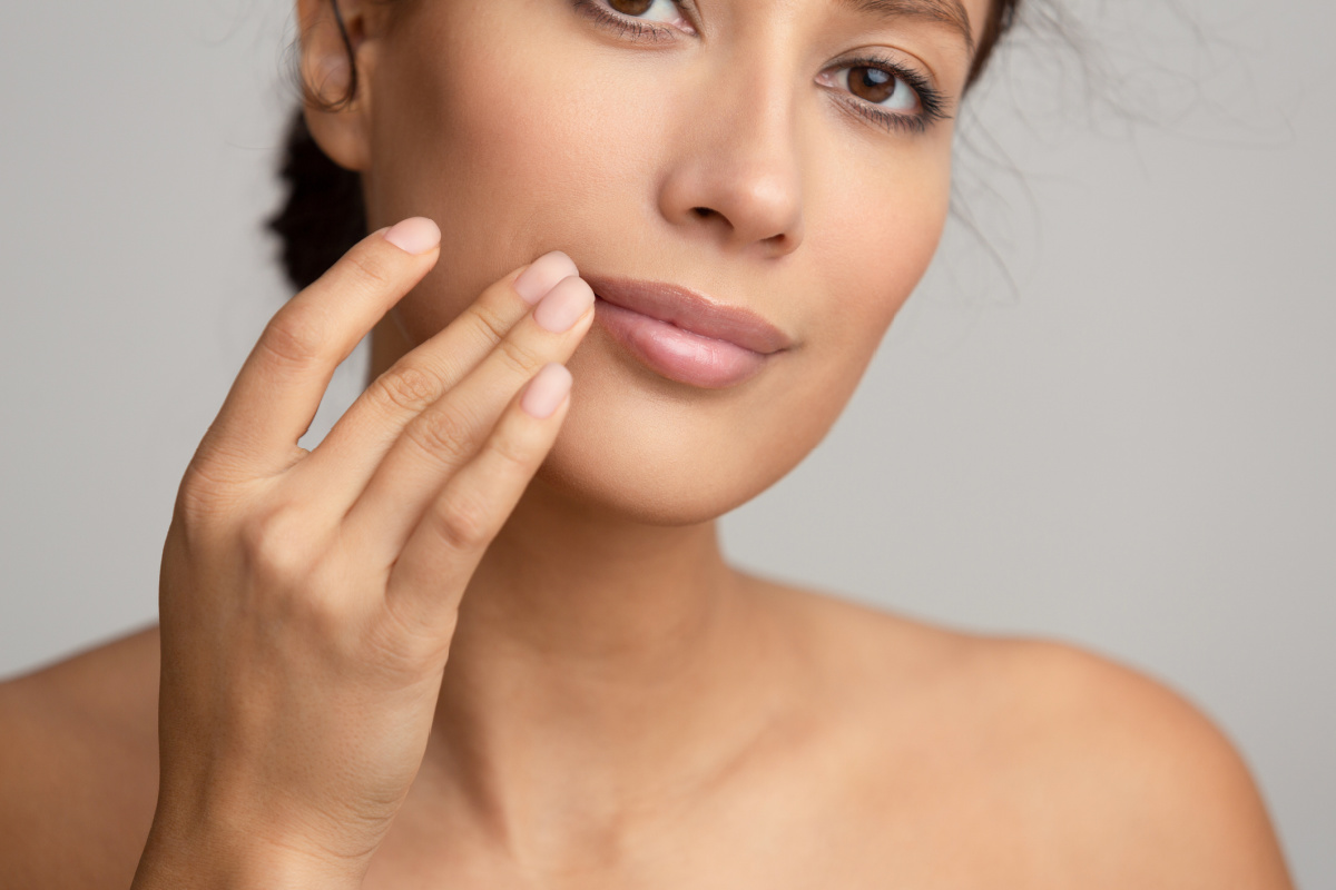 Woman touching her lips